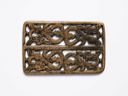Garment plaque with four coiled felines savaging does. Courtesy of The Museum of Fine Arts