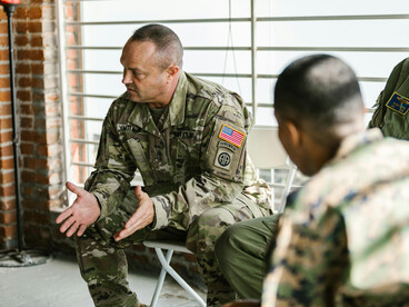 A war veteran in a counseling session, revealing the deep emotional scars and trauma of combat