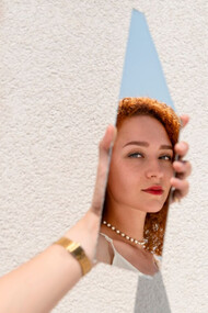 A women facing herself in fragments, identity is not reclaimed all at one, but rediscovered piece by piece in unexpected places