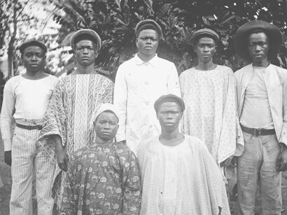 A group of men at a cocoa bean plantation in the late 1800s, representing the strength and resilience even under the extenuating circumstances