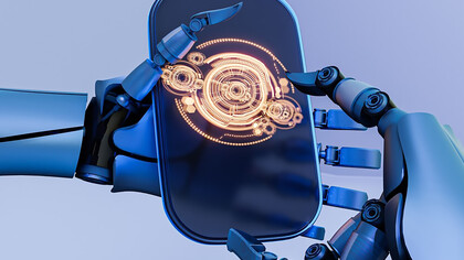 A robot's hands gently holding a smartphone, showcasing intricate details of its metallic structure and the phone's screen