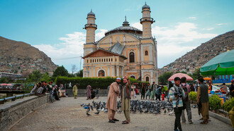 Tourists taking a selfie in front of the Shah-Do Shamshira Mosque in Kabul, Afghanistan