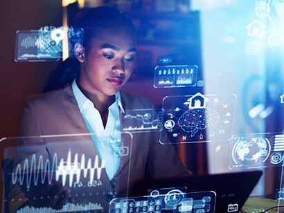 A young woman working late in the office, applying systems engineering to advance digital transformation with generative AI