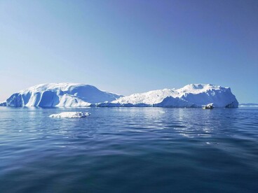 Floating between permanence and disappearance, the iceberg reflects the quiet urgency of global warming