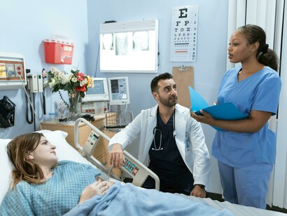 A doctor is speaking with a patient during a consultation