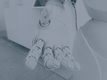 An AI robot's hand representing how far technology has come and how it continues to evolve