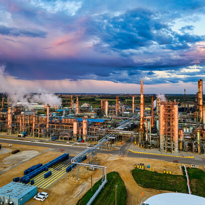Clouds hang over an oil refinery in Rosemount, Minnesota, a stark image of the emissions-intensive fossil fuel industry