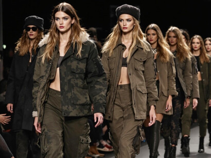 Models walking on the catwalk in camouflage outfits