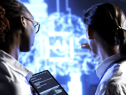 Qualified technicians brainstorm ways to use AI and cognitive computing to extract meaningful insights from complex data, while a team of specialists implements artificial intelligence to process massive datasets