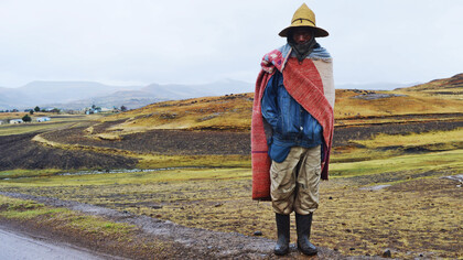 A Lesotho herder wears a Basotho blanket, a covering commonly worn, which has become a national symbol