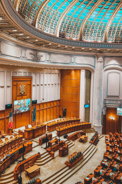 The interior of a large domed building, used as a parliament