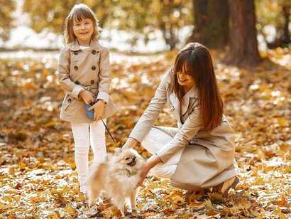 A tender family moment outdoors in fall, illustrating thankfulness for connection and companionship