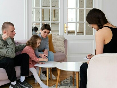 Family engaging in therapy, fostering emotional support to help children cope with stress and anxiety