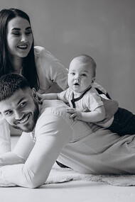 A happy family embracing the joys of parenthood with their first child