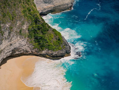 Aerial picture of a beach. Commercial tasks done by drones involve photography, mapping, and delivery