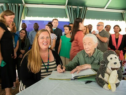 Jane Goodall signing during her visit to the United States Mission in Uganda, April 4, 2022