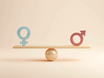 The concept of gender equality is represented by a balanced scale, with the male and female symbols equally weighed on either side