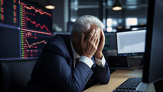 A man appears distressed and overwhelmed by the banking crisis