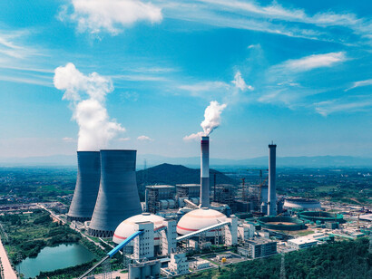 Industrial power facility with towering smokestacks in Jiujiang, Jiangxi, China, symbolizing energy production and its environmental impact