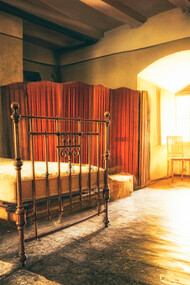 A dilapidated hotel room where the author finds themselves in his quest for destiny