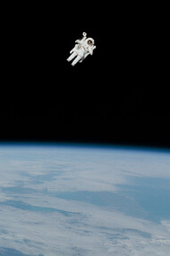 An astronaut floating on space with the Earth as background