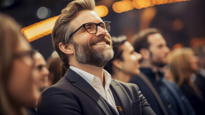 A man listening thoughtfully during a presentation, embodying the essence of active listening in professional settings