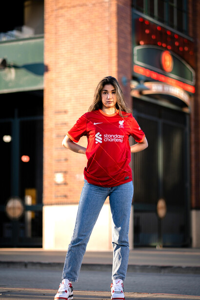 Female football fan in a Liverpool FC shirt