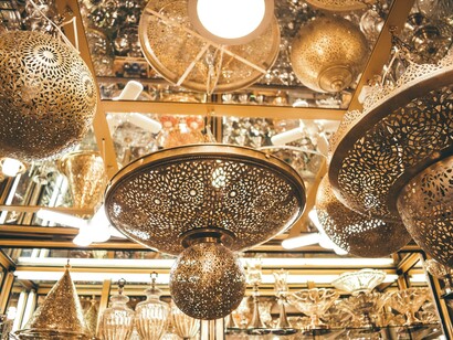 A collection of lanterns in Fes, Fez-Meknès, Morocco, illustrating how the local business utilises traditional craftsmanship to create unique and vibrant products 