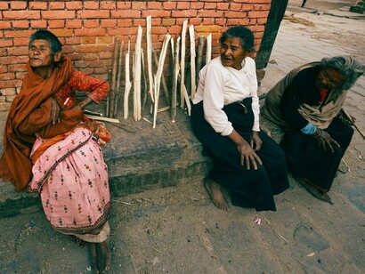 A group of homeless women on the streets, conveying the urgent need for just and inclusive housing solutions