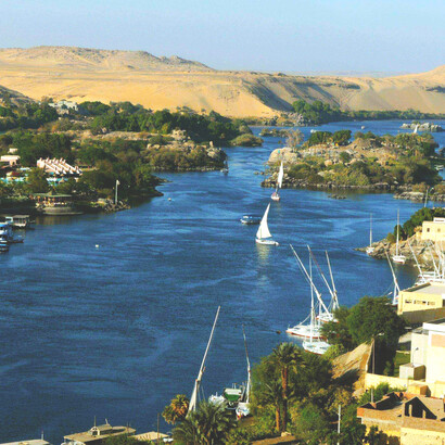 The Nile River, one of the longest rivers in the world, flows northward across Africa into the Mediterranean Sea. Stretching about 6,650 kilometers (4,130 miles), its vast drainage basin spans eleven countries: the Democratic Republic of the Congo, Tanzania, Burundi, Rwanda, Uganda, Kenya, Ethiopia, Eritrea, South Sudan, Sudan, and Egypt