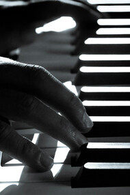Hands move across the piano, channeling talent shaped by conflict, culture, and resistance