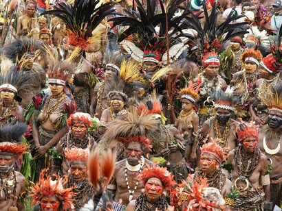Elders and leaders gather in ceremonial dress, carrying the wisdom of generations