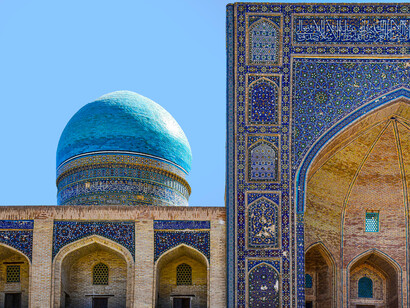 Mir-i-Arab Madrasa rising in the heart of Bukhara, where centuries of devotion and craftsmanship meet in quiet harmony, Uzbekistan