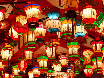 Each lantern tells a story steeped in Chinese mythology, casting a warm yellow and red hue that creates an enchanting atmosphere for festival-goers and photographers alike at the Nagasaki Lantern Festival in Japan