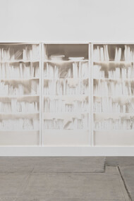 Delocazione 2024, smoke and soot on board 150 x 600 cms. The architecture of knowledge rendered in absence. Claudio Parmiggiani's "Delocazione" is a profound exploration of space, memory, and the silent narratives held within empty forms. Image courtesy of the Artist/Estorick Collection of Modern Italian Art