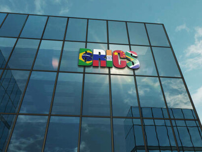 A futuristic glass building concept representing the BRICS alliance and its expanding influence