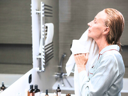 A woman prepping herself, embodying the idea that staying youthful begins with intentional daily choices