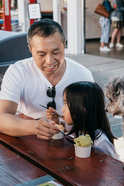 A father and daughter enjoying ice cream together