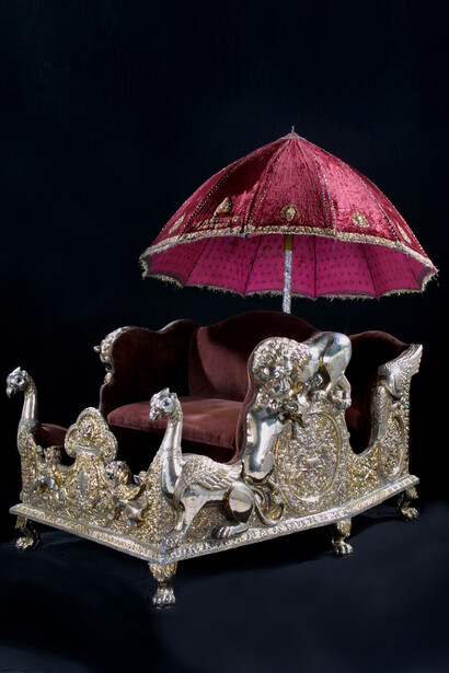 Elephant seat (howdah), approx. 1870–1920. India; Chhattisgarh state; former princely state of Surguja. Partially gilded and painted silver over wood, with velvet and wicker. Courtesy of Asian Art Museum, Acquisition made possible by Nancy B. Hamon in honor of Johnson S. Bogart, 2001.12.a-.c.