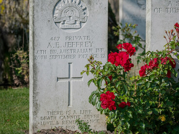 United Kingdom – A World War I military cemetery gravestone adorned with roses