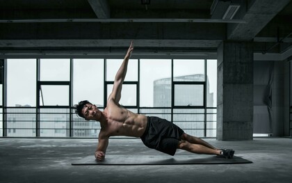 Healthy living illustrated by a man performing yoga to relax and stay fit