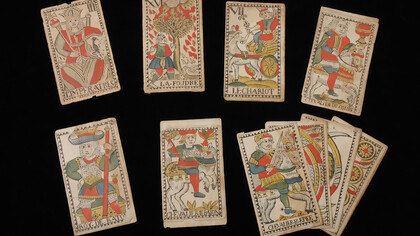 Twelve cards from a tarot deck with French text