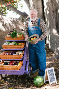 A farmer proudly displays his nutrient-rich harvest, showcasing nature's gifts for a healthier lifestyle