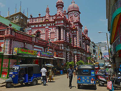 Crowds move through the energetic streets of Colombo, where local businesses bring the city to life, Sri Lanka