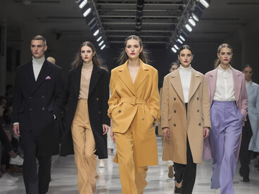 Models walk the catwalk showcasing genderless fashion, reflecting new trends in the fashion industry