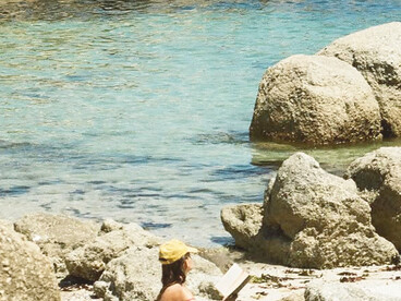 Reading in the sun, Saunders Rock Tidal Pool, Sea Point, Cape Town, photographed by Samantha Caitlin