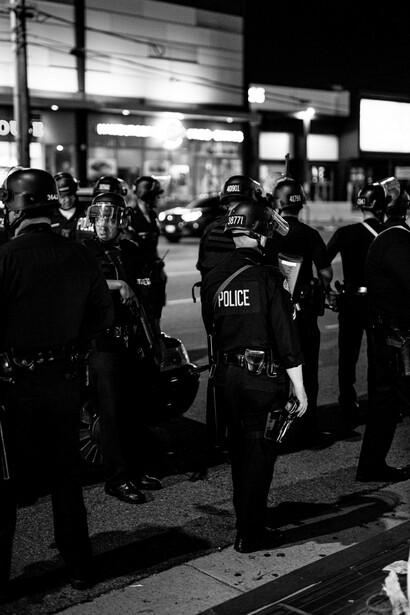 Law enforcement officers monitoring the streets during protests, including Black Lives Matter, illustrating the conflict between police authority and the demand for human rights