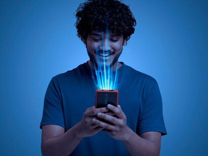 Someone gazing at their device, illustrating the role of facial recognition, biometric technology, AI surveillance, and privacy in modern security