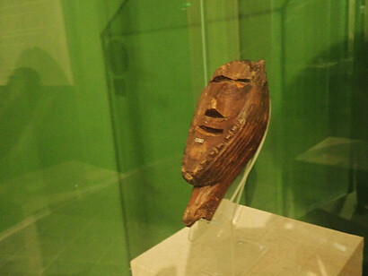 Visitors viewing the Shigir Idol in the museum — A moment of quiet reverence for what may be humanity’s first attempt at monumental religious art, Russia