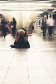 A young man overwhelmed with political fatigue and the question of whether to stay or leave